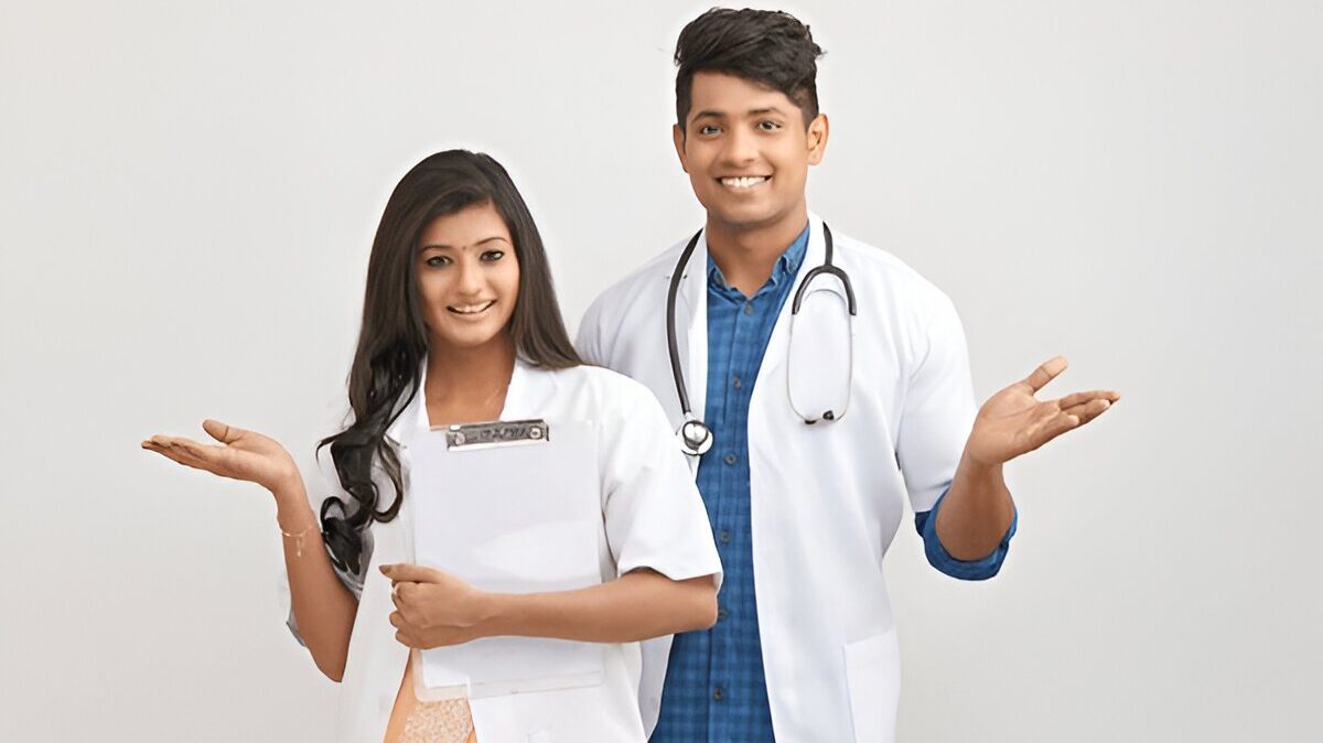 Smiling medical students in white coats representing MBBS admission guidance